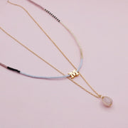 Set Dos Collares Letra Dorada Cuarzo Rosa