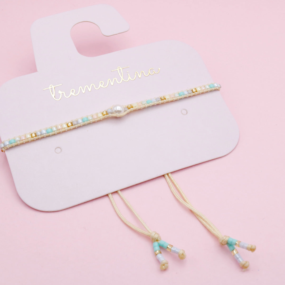 Pulsera Tejida Tonos Pastel con Perla Central
