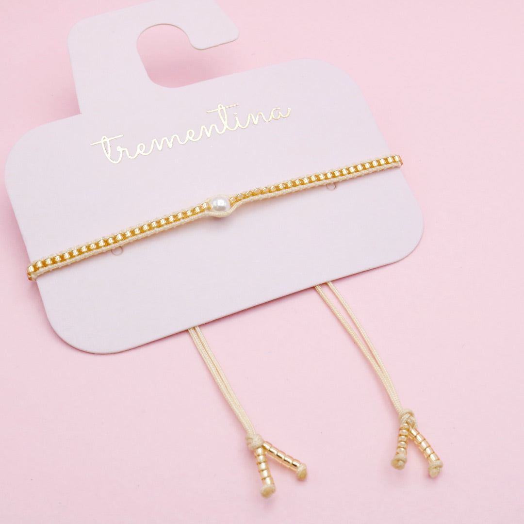 Pulsera Tejida Dorada con Perla Central