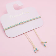Pulsera Tejida Tonos Turquesa con Perla Central